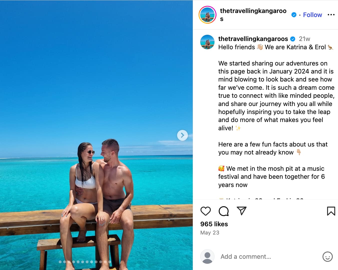 Katrina and Erol pose in front of crystal blue water in Hamilton Island
