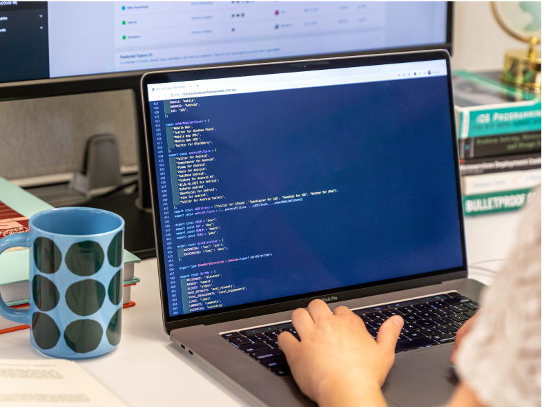 Over the shoulder of an engineer writing code for our platform.