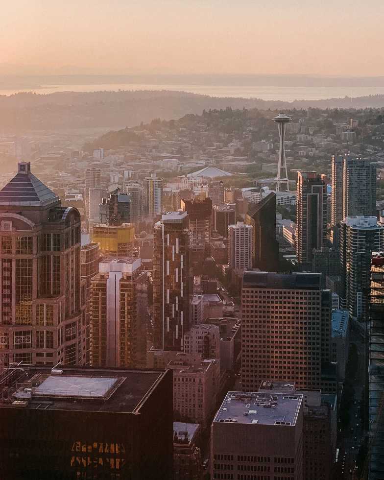  Sunrise kisses the skyscrapers and bay of downtown Seattle.