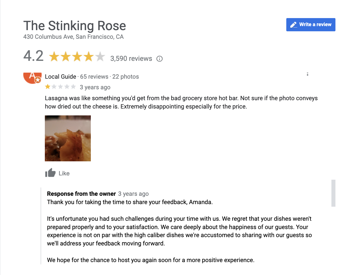 A negative review of the Stinking Rose on Google. The restaurants responds to the review by thanking the customer for the feedback, apologizing for the bad experience and noting they will address their feedback in the future.